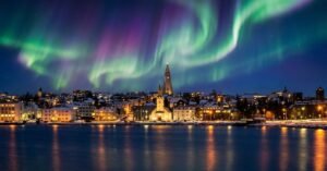 reykjavik iceland skyline with northern lights, colorful aurora over city, reykjavik iceland attractions