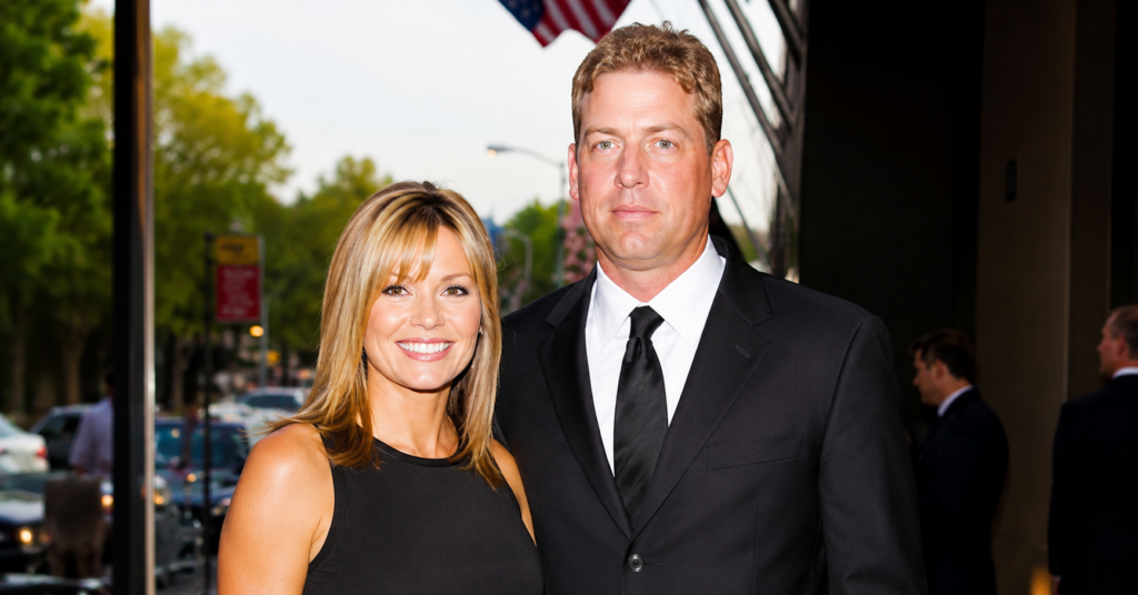 Rhonda Worthey and Troy Aikman posing together at a formal red carpet event in elegant black outfits, high-resolution celebrity couple photo.