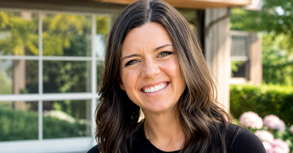 Portrait of Ashley Flynn from Tipp City, Ohio, smiling outdoors in natural daylight with a softly blurred residential background, featured in a high-resolution editorial-style image.