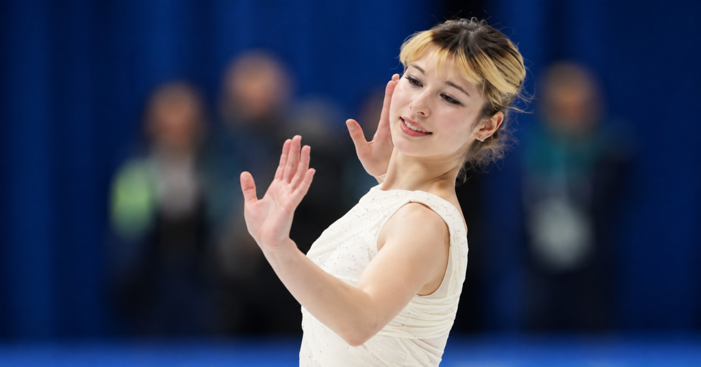 Is Alysa Liu Gay search topic related to Alysa Liu during a figure skating performance, showcasing her graceful pose on the ice.