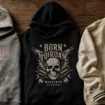 Zach Bryan merch hoodie next to a Hellstar graphic tee and Parke sweatshirt on a flat lay surface