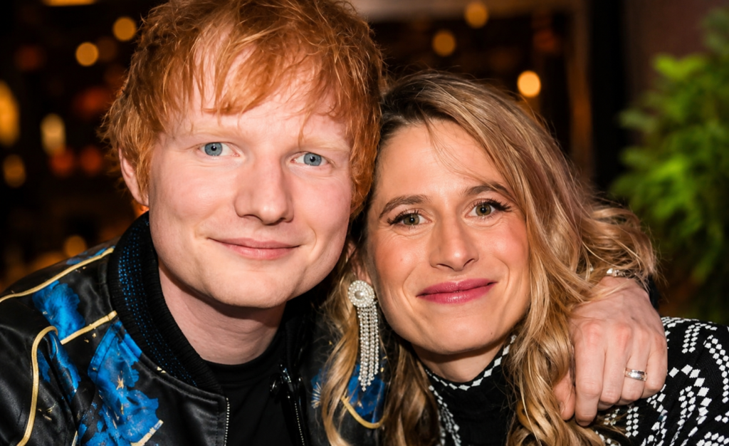 Ed Sheeran smiling alongside his wife Cherry Seaborn during a public appearance.