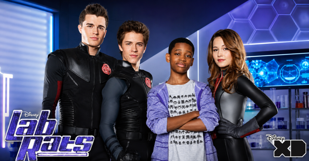 Lab Rats cast featuring William Brent, Spencer Boldman, Tyrel Jackson Williams, and Kelli Berglund in a Disney XD promotional image.